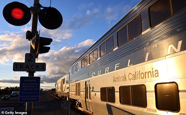 Authorities say the train was stopped about a quarter-mile back from where the car hit an SUV