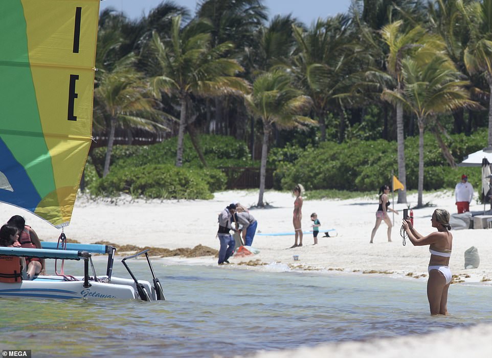 Adventurous: Her three eldest kids went parasailing