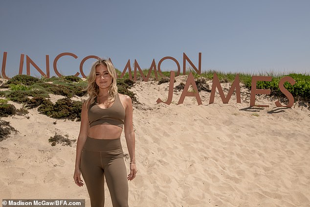 Beach weekend: In addition to rocking a brown sports bra and matching leggings, the mother-of-three sported a few of her designs, including a gold chain around her neck and a few rings