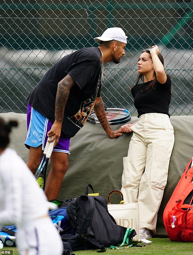 The smitten tennis star kissed Costeen's hand as they walked around and couldn't keep his eyes off her as he trained for the event