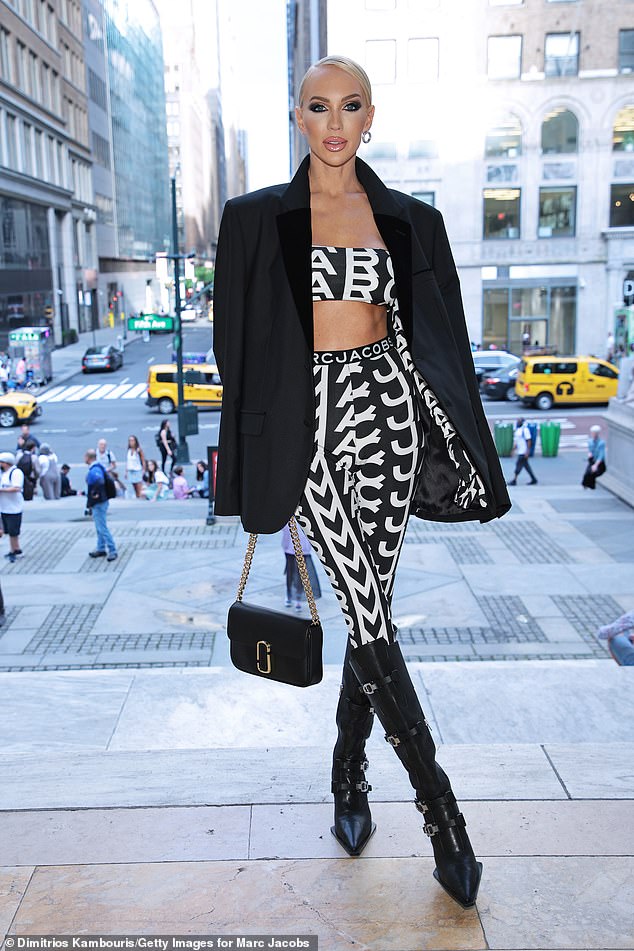 Decked out: The 33-year-old reality star wore the 59-year-old designer's 'Monogram' crop-top and leggings while posing inside the marble halls of the Stephen A. Schwarzman Building