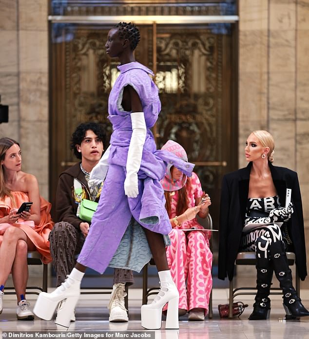 Livestreamed in Times Square! All attendees had a coveted front row seat for the show featuring pastel heavy knits with white platform boots as well as glamorous gowns in black PVC and colorful metallics