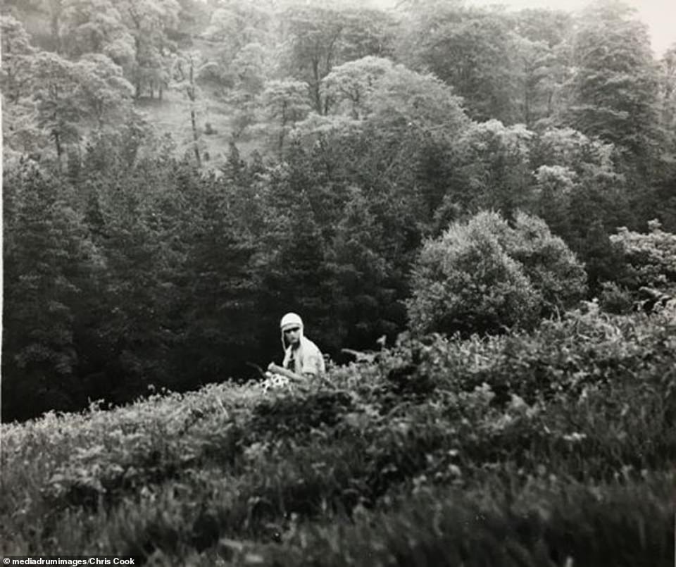 Hindley is seen sitting whilst wearing headgear in an image from Brady's Tartan Album. The killer died while in prison in 2002