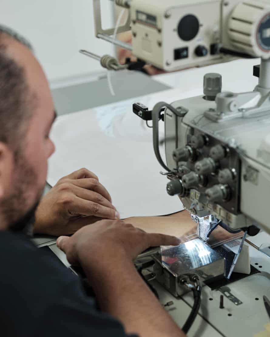 A worker uses a machine