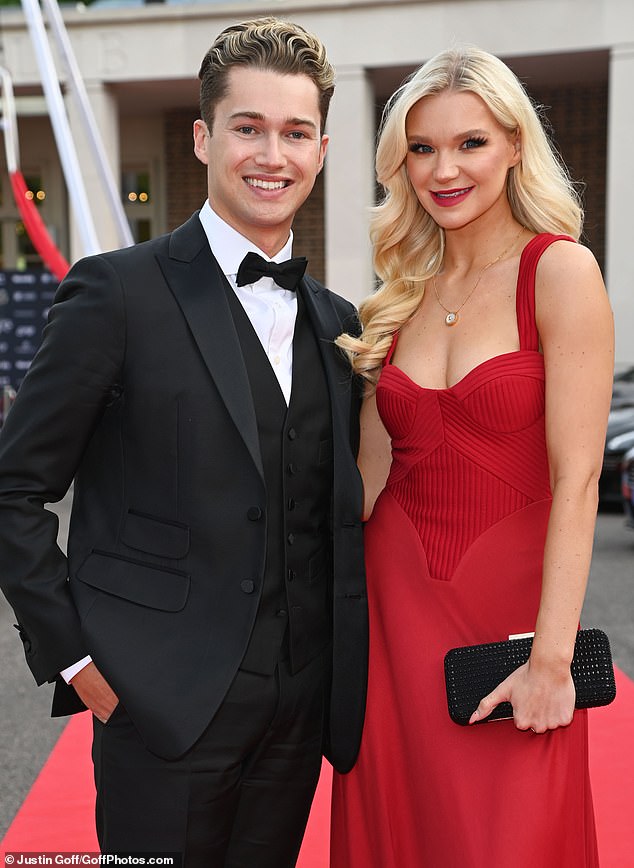 Incredible: Abbie, 25, stood out from the crowd in an eye catching red gown which cascaded to the floor from a corset style top