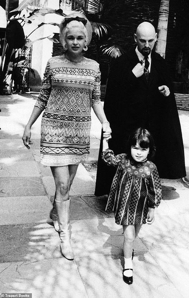 Unusual choices: Mansfield picture with her daughter Harigaty while spending time with her friend, Satanist Anton LaVey (undated photo)