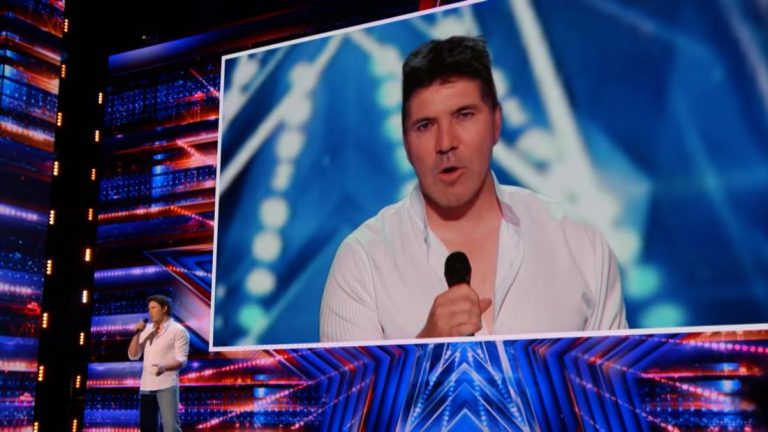 Simon Cowell shocked while watching himself perform through AI