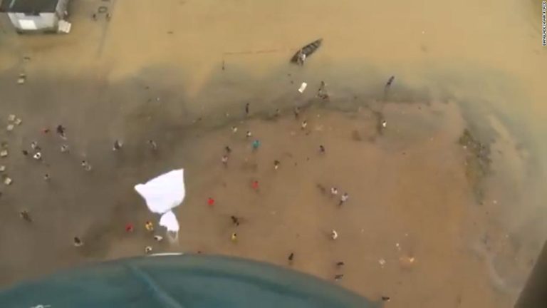 Video shows air force distribute food to residents stranded by floods in Bangladesh