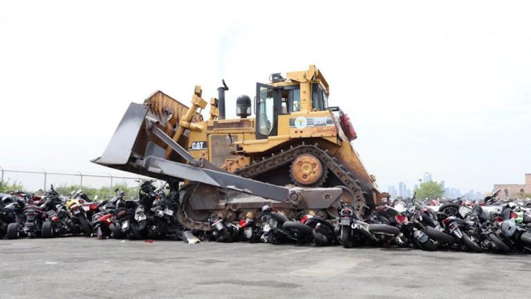 NYPD bulldozes nearly 100 illegal motorbikes and ATVs