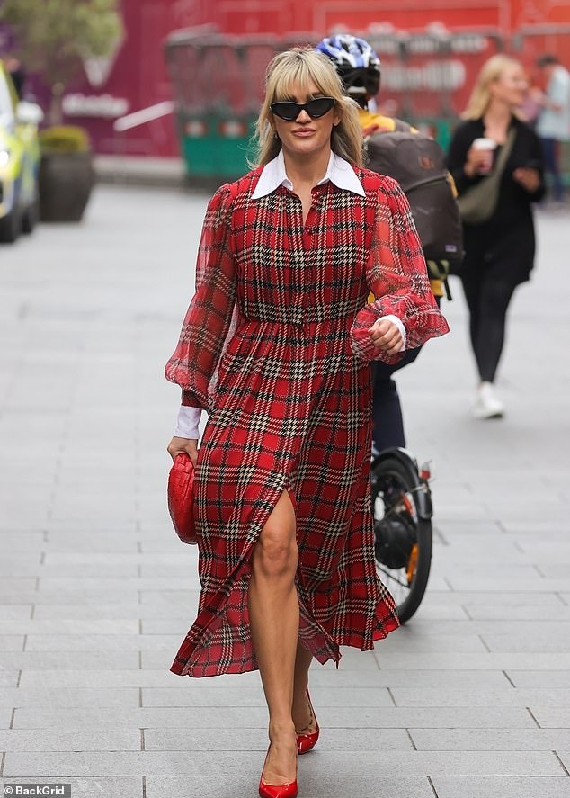 Ashley Roberts looks typically fashion forward in red tartan dress with daringly high slit