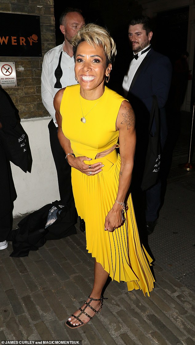 Dame Kelly Holmes stuns in a yellow dress as she joins a host of stars at the LGBT awards afterparty