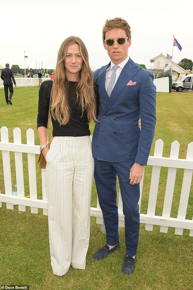 Eddie Redmayne looks dapper as he puts on a loving display with wife Hannah at The Royal Windsor Cup