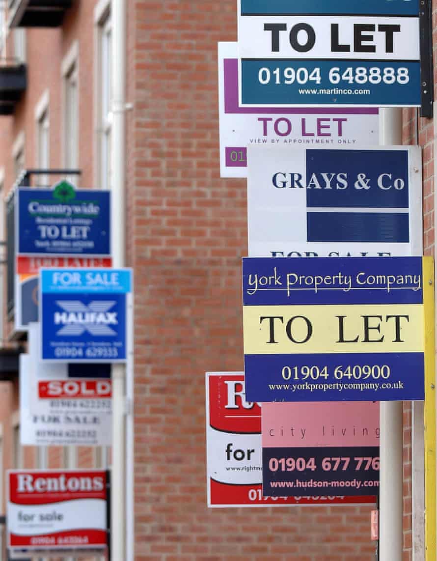 dozens of to let signs adorn a building