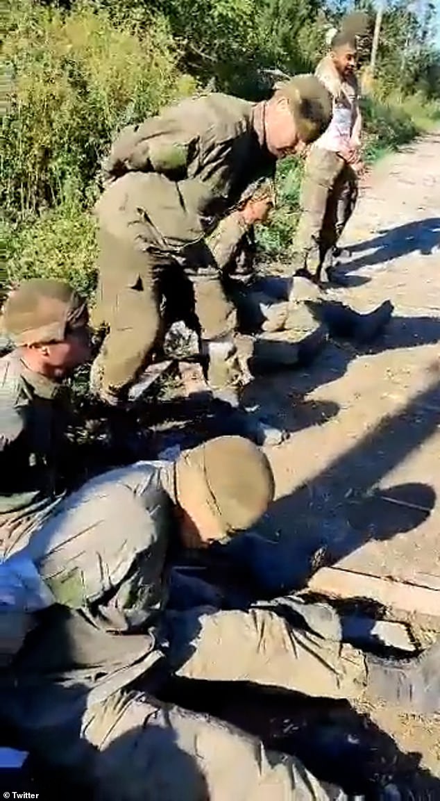 Footage claims to show 14-battle-hardened Russian soldiers surrendering to Ukraine on battlefield