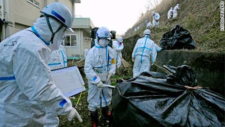 Decontamination work near an elementary school in Katsurao, near the tsunami-crippled Fukushima Daiichi nuclear power plant, on December 4, 2011. 