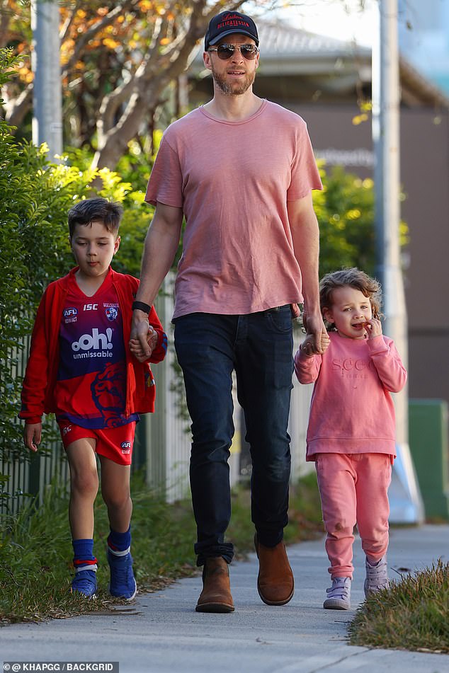 Gold Logie winner Hamish Blake dotes on his children as he joins Michael Wipfli at a Sydney park