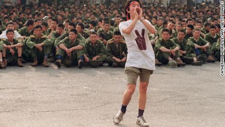 A student asks soldiers to go back home as protesters continue in central Beijing, on  June 3, 1989.  