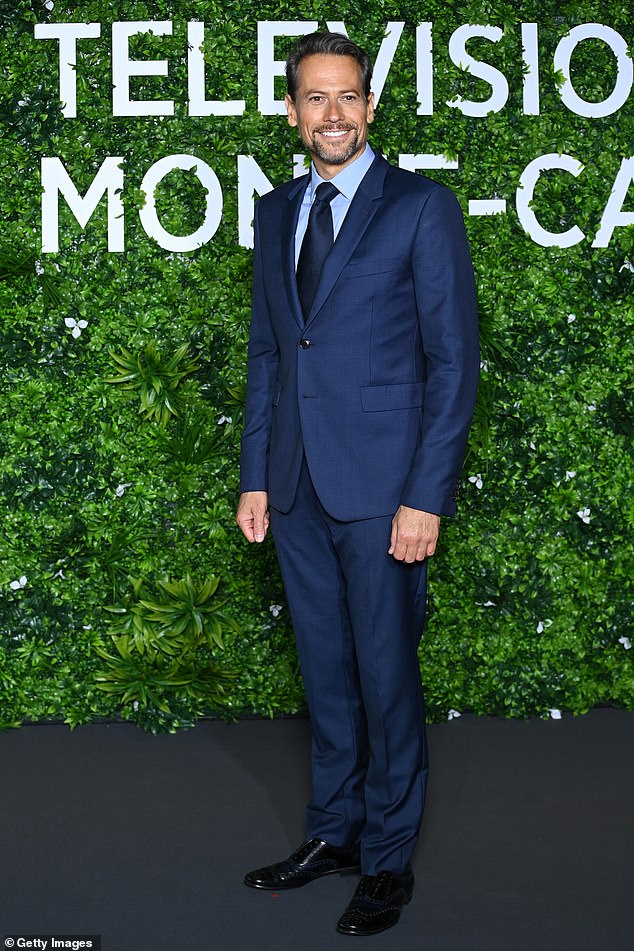 Ioan Gruffudd dons a navy suit at Monte Carlo Festival after jetting out of LA with Bianca Wallace