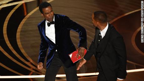 Chris Rock and Will Smith on stage at the Oscars in March.