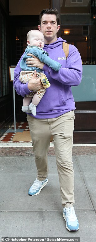 John Mulaney and Olivia Munn stay close to their son Malcolm while stepping out in New York City