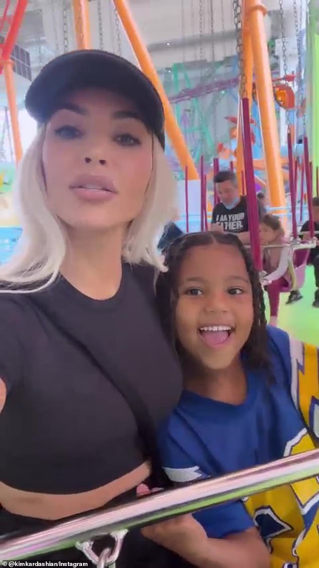 Kim Kardashian enjoys a rollercoaster ride with son Saint, six, after SCOLDING him