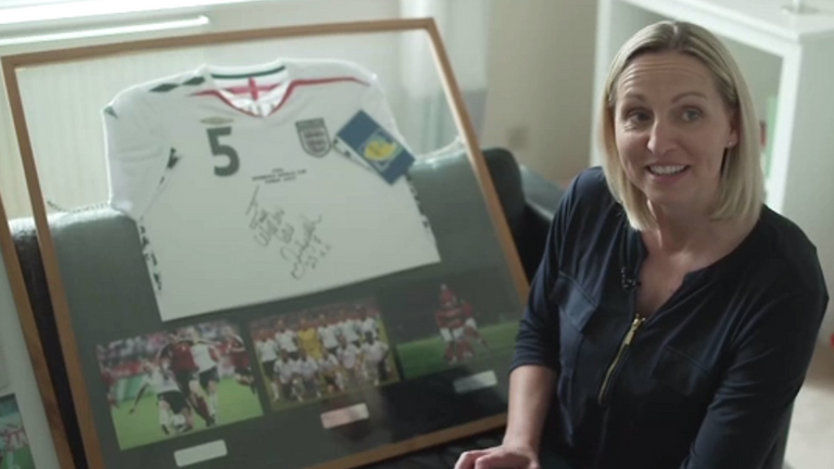 Faye White displays some of her memorabilia from her football career