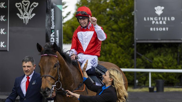 Jockey Jack Mitchell in the winners enclosure after winning the SBK Oaks Trial Fillies&#39; Stakes aboard Rogue Millennium