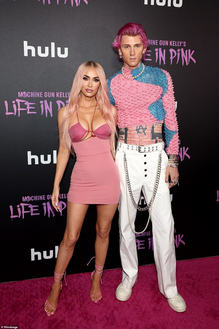 Megan Fox debuts blonde hair with pink highlights as she supports Machine Gun Kelly at premiere