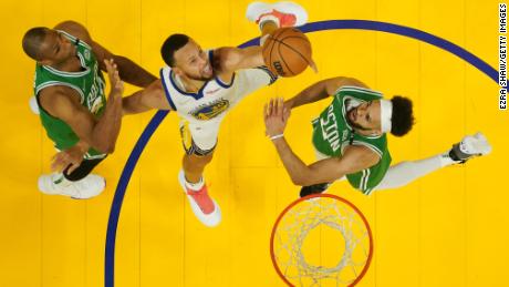 Curry shoots during the first half against the Celtics.