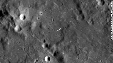 The new crater is smaller than others and not visible in this view, but its location is indicated by the white arrow. 