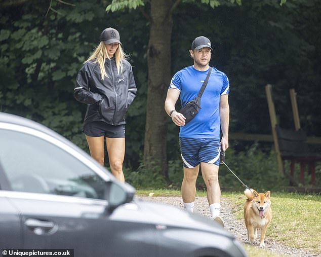 Olly Murs and new fiancée Amelia Tank step out to walk dog in first appearance since engagement