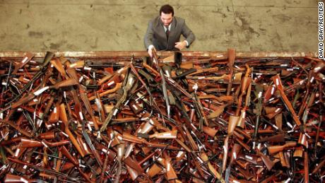 A gun reform project manager for the New South Wales Police looks at a pile of thousands of firearms in Sydney that had been handed in as part of the Australian government&#39;s buy-back scheme in July, 1996.  