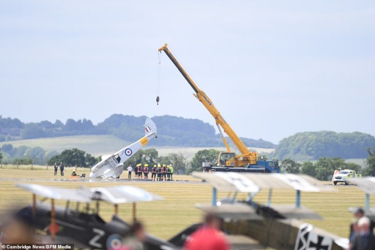 Passengers led to safety after 1930s bi-plane CRASHES into ground at Duxford Air Show