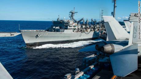 The fast combat support ship USNS Rainier steams alongside the aircraft carrier USS John C. Stennis during a replenishment-at-sea during the Rim of the Pacific maritime exercise in 2016.