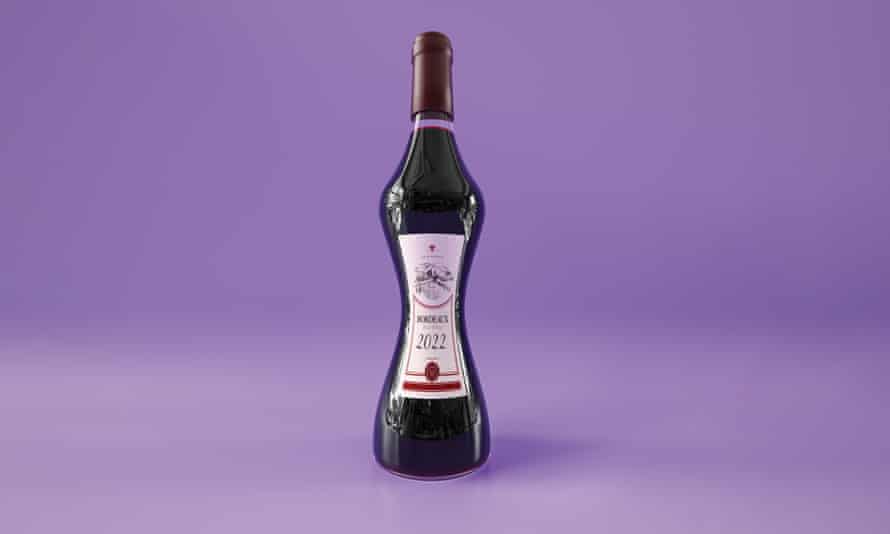 A bottle of red wine that is squeezed in the middle