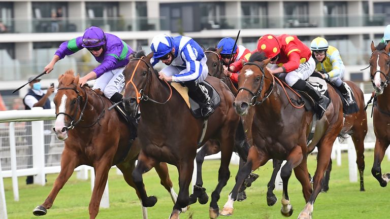 Nelson Gay, right, chases home Cairn Gorm at Newbury