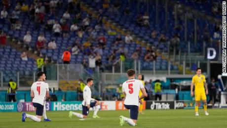 Declan Rice (far left) and John Stones (center right) take the knee prior to England&#39;s Euro 2020 quarterfinal against Ukraine.