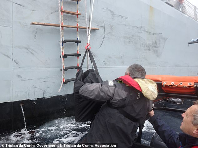 The vaccines being lowered down from the HMS Forth. The jabs had to be of the Oxford/AstraZeneca make as these were the only ones that could survive the trip