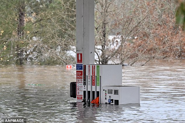 A submerged petrol station as floodwaters continued to rise in Camden on Sunday