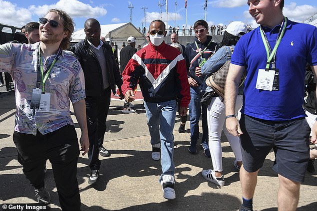 Supporters attempt to get a selfie with Hamilton who has been the centre of attention ahead of his home race at Silverstone following the comments made by Piquet