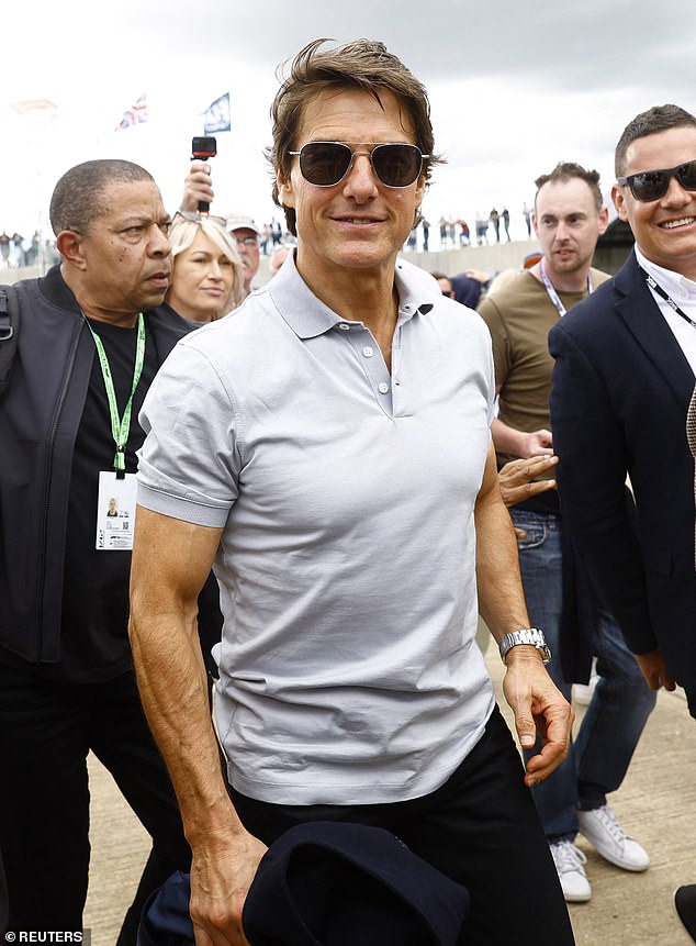 Buff: Hollywood hero Tom Cruise was also among the celebrities flocking to see Lewis Hamilton battle for the win