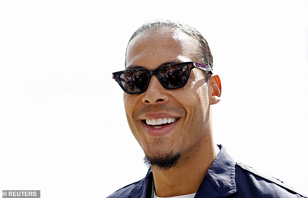 Off season: Liverpool's Virgil van Dijk was all smiles as he bagged a ticket for the big race