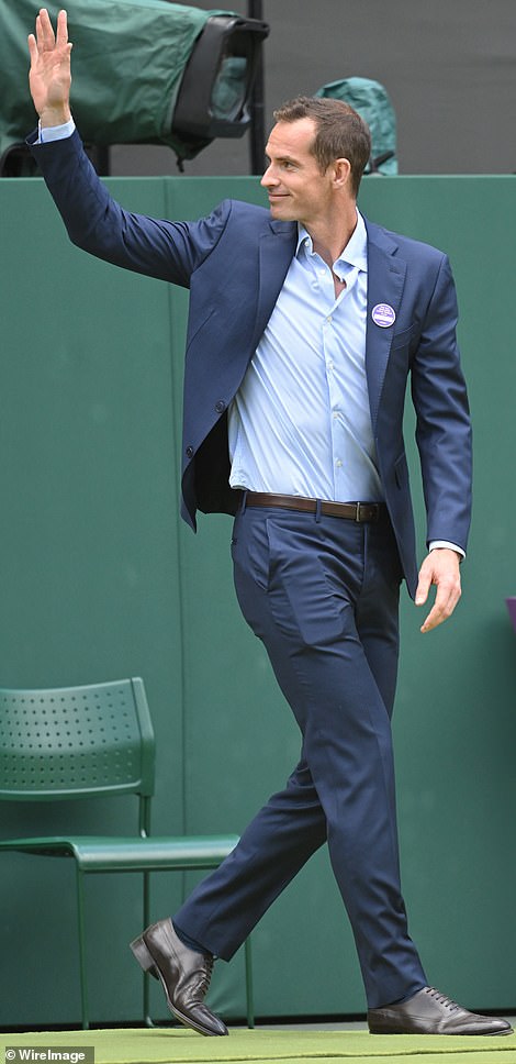 Beaming: Andy Murray and Roger Federer looked dapper as they both donned suits while strolling onto the court and waving at fans