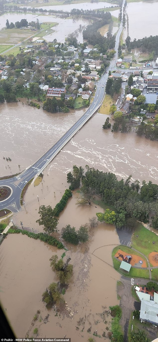 The NSW State Emergency Service said 83 people - including a mother and her newborn - had already been whisked to safety in the last 24 hours to Sunday. (pictured, flooding in the Chipping Norton, Nepean and Hawkesbury areas)