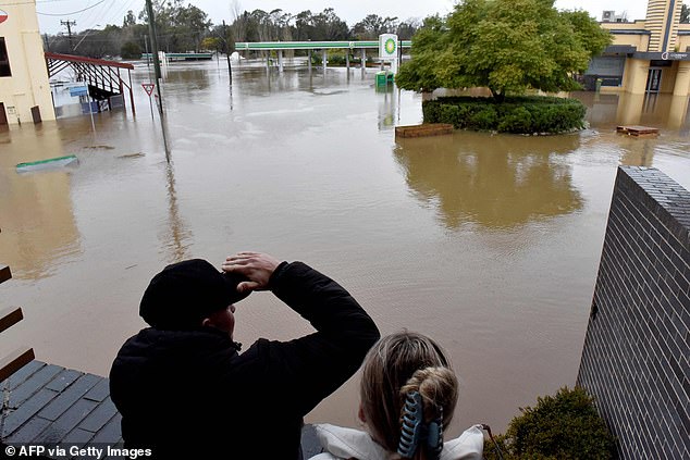 Emergency Services and Resilience and Flood Recovery Minister Steph Cooke told residents not to assume they are safe from floods (pictured, floodwaters in Camden)