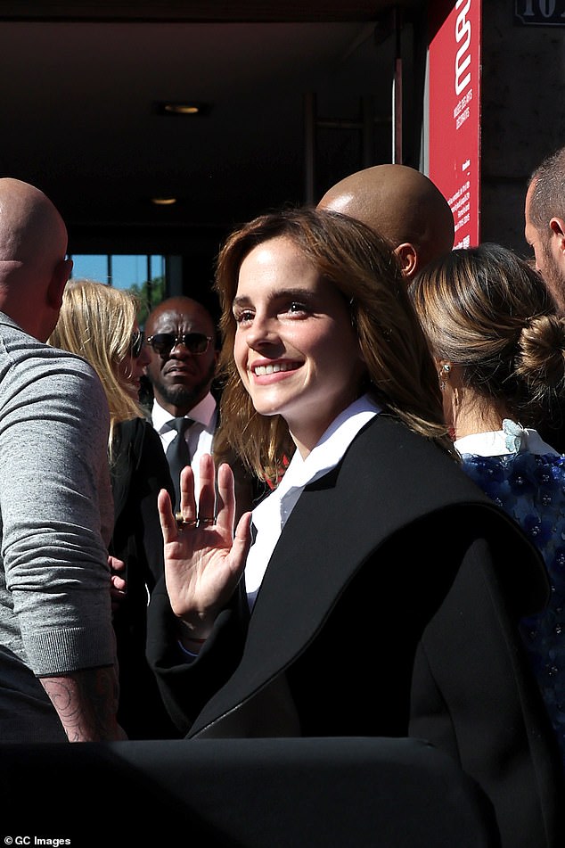 Beauty: Emma's light brown locks were left down, falling alongside her jaw in a softly tousled curl