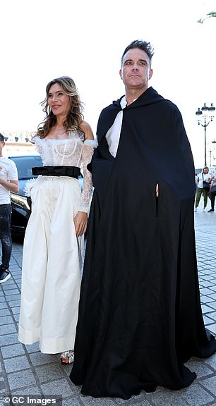 In style: Ayda looked stylish in a white semi-sheer off-the-shoulder corset top with lace detail for the event