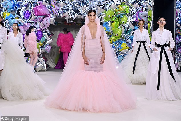 On show: Bianca Brandolini d'Adda looked glamorous in a pink puff gown as she walked in the show