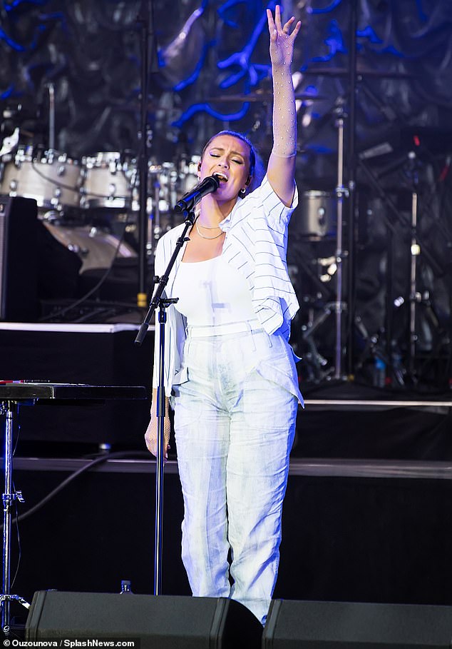 Tori's look: The other opening act was Tori Kelly, who took to the stage with a white top under a white top with black stripes and two gold necklaces