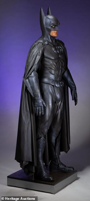 Unique: The suit also includes 'a hero signature cowl, full length superhero cape with 2-cape clips, muscle tunic with signature "Batman" icon on the chest, muscled tights, peaked and finned gauntlet gloves, and knee-high character boots'